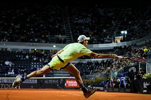 Tommy Paul returns the ball to Nicolas Jarry